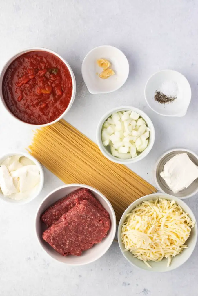 Million Dollar Spaghetti Ingredients: Spaghetti, Ground Beef, Cream Cheese, Sour Cream, Ricotta, ug Shredded Cheese