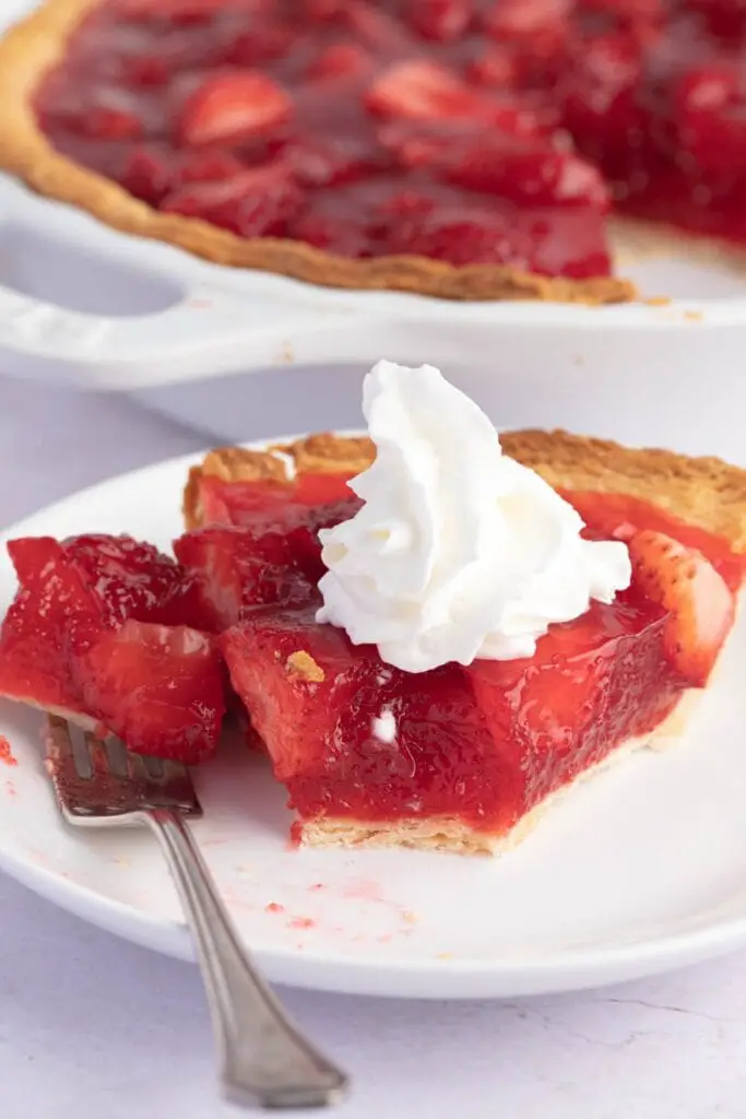 Sliced ​​Homemade Strawberry Shortcake with Whipped Cream